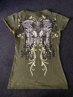 Angel wings alternative top cross y2k affliction Xtreme Couture bling mcbling green diamond top slim fit womens top outfit inspo streetwear emo punk inspiration foryoupage fyp homefeed homepage Vintage Stuff, Angel Wings, Angel, Fashion Outfits, Wardrobe