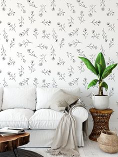 a white couch sitting next to a wooden table