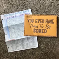 two pieces of paper that have been placed on the floor with words written on them