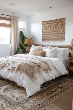 a large bed sitting in a bedroom next to a window