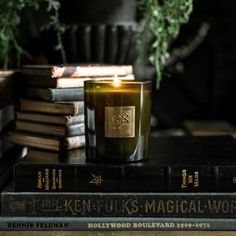 a candle sitting on top of some books