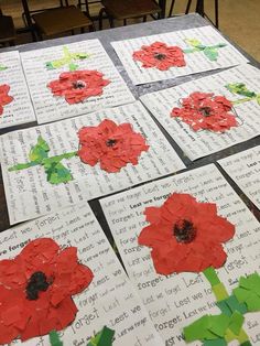 several pieces of paper with red flowers on them