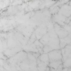 a white marble textured surface that looks like it could be used as a background