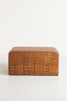 a wooden box sitting on top of a white surface