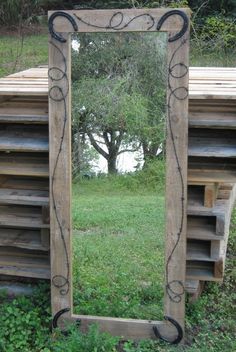 a mirror that is sitting in the grass