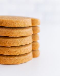 a stack of cookies sitting next to each other on a white counter top in front of the camera