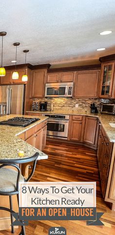 a kitchen with an island and bar stools next to the counter top that is open