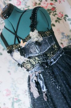 This dress starts as a zip up medium 32 inch waist with several elastic cross bodies. The bust is a mix of laces and velvet handsewn and machine stitched. The dress is several layers of various tiers of laces, sequins and tulle. Very ethereally gothic. Detail of black fabric flowers creep along the bust and trail into the tulle. Dress Clothes For Women, Ball Gown, Fabric Flowers, Black Fabric, Dahlia, Hand Sewing, Ball Gowns, Favorite Outfit, The Dress