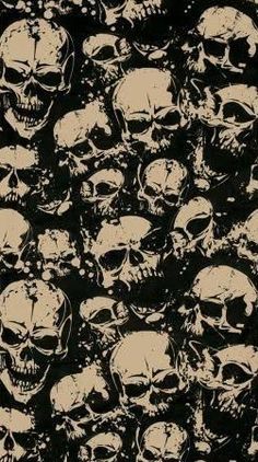 a large group of skulls are shown in black and beige colors on a dark background