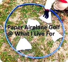 paper airplane golf @ what i live for with two hands holding a blue hose in front of it