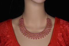 Beautiful ruby necklace with pressing style earrings. South traditional necklace . Suitable for pattu sarees Pink Jewelry For Puja Festivals, Pink Temple Jewelry Necklace For Festive Occasions, Pink Temple Jewelry Necklace For Festivals, Pink Temple Necklace For Festive Occasions, Elegant Pink Temple Necklace For Festivals, Festive Pink Temple Necklace, Red 22k Gold Necklace For Diwali, Pink Jewelry For Diwali Puja, Diwali Red 22k Gold Necklace