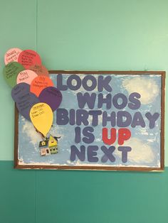 a birthday sign with balloons and writing on it that says, look who's birthday is up next