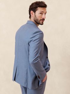 This timeless suit jacket is cut from an Italian wool fabric we love for its subtle twill texture.  Designed to carry you through all seasons, this beautiful fabric is woven in a Super 120's weight--the perfect balance of fine handfeel, beautiful drape, and everyday durability.  Wrinkle-Resistant, Breathable, Stretch Tailored Slim Fit: More relaxed than our Slim Fit, this Italian cut style has a softer shoulder construction.  Fabric from Italy's Lanificio Guabello.  Notch lapel with 2-button fro Blue Three-piece Suit With Long Sleeves, Business Casual Three-piece Suit With Single Button, Tailored Tweed Jacket With Suit Collar, Tailored Blue Suiting Fabric Outerwear, Tailored Blue Outerwear In Suiting Fabric, Tailored Timeless Tweed Jacket With Pressed Crease, Tailored Tweed Jacket In Suiting Fabric, Timeless Tailored Tweed Jacket With Pressed Crease, Blue Semi-formal Outerwear In Suiting Fabric