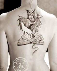 the back of a woman's body with an owl and book tattoo on it