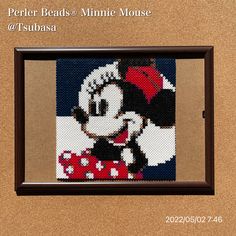 a cross stitch picture of a minnie mouse