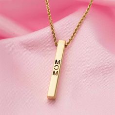 This Best Mom Necklace in 9K Gold is a stunning tribute to the unconditional love of motherhood. Crafted in 9K gold, the bar necklace design is both elegant and sentimental. Perfect for any occasion, this necklace is sure to make any mom feel cherished and appreciated.Weight 2.39 gramsSize 20 inches Minimalist Name Bar Necklace For Mother's Day, Minimalist Bar Necklace For Mother's Day Personalized Gift, Minimalist Bar Necklace For Anniversary Or Mother's Day, Elegant Custom Name Bar Necklace For Anniversary, Elegant Gold Bar Necklace For Mother's Day, Elegant Everyday Bar Necklace For Mother's Day, Gift Rectangular Pendant Bar Necklace, Gold Nameplate Bar Necklace For Mother's Day, Engraved Gold Bar Necklace For Mother's Day