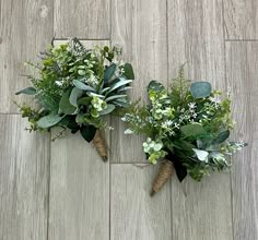 two bouquets of flowers are sitting on the floor next to each other with leaves