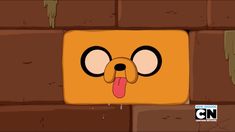 an animated character sticking his tongue out from behind a brick wall with the caption's name on it