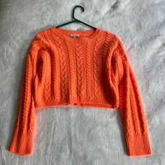 Cute Cable Knit Cropped Sweater By Better Be In The Color Bright Orange. Cable Knit Material, Crew Neck, Wide-Ribbed Edges, Long Sleeves, Padded Shoulders And A Cropped Length. Shell: 100% Wool. Lining: 93% Nylon, 7% Elastane. Size: Women’s S. Only Used Once. In Great, Almost Brand New Condition. No Damages, No Tear Or Wear. Spring Cropped Cable Knit Sweater, Cropped Pointelle Knit Sweater, Cropped Pointelle Knit Cardigan For Winter, Winter Cropped Pointelle Knit Cardigan, Cropped Pointelle Knit Sweater For Winter, Winter Cropped Pointelle Knit Sweater, Cropped Open Knit Winter Cardigan, Casual Cropped Knitted Sweater, Trendy Cropped Knitted Sweater