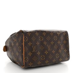 This is an authentic LOUIS VUITTON Monogram Speedy 25. This stylish handbag is crafted of signature Louis Vuitton monogram coated toile canvas in brown. The handbag features vachetta cowhide leather top handle and trim with gold-toned hardware. The top zipper opens to a cocoa brown fabric interior with a hanging pocket. Speedy 25, Cocoa Brown, Brown Fabric, Authentic Louis Vuitton, Leather Top, Cowhide Leather, Louis Vuitton Monogram, Top Handle, Cocoa