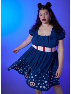 a woman in a blue dress with stars on the skirt and red, white, and blue lipstick