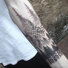 a person with a tattoo on their arm