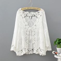 Crochet Lace Kimono Summer 2024 Fashion Holiday Lace Up Tops Women Long Sleeve Hollow Out White White Lace Cardigan Shirt, Luxury V-neck Lace Top For Summer, Luxury Summer Lace V-neck Top, Cheap Lace Blouse For Vacation, Cheap White Summer Cardigan, Affordable White V-neck Lace Top, Cheap White V-neck Lace Top, Cheap Summer Blouse With Lace Trim, Cheap Lace Top For Vacation