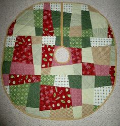 a quilted table top with red and green squares