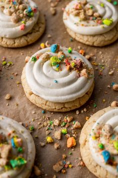 cookies with white frosting and colorful sprinkles