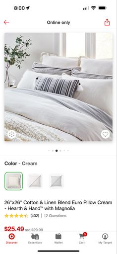 a bed with white linens and pillows on the bottom right hand corner is an instagram page