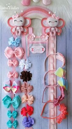 an assortment of hair clips are displayed on a white surface with pink and blue colors