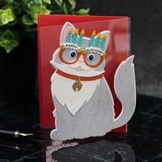 a birthday card with a cat wearing glasses