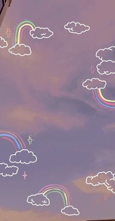 the sky is filled with rainbows and clouds as well as some stars in the sky