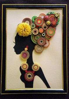 an art work made out of buttons and paper with a woman's head in the center