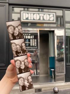 a person holding up three photos in front of a building with the words photo shop on it