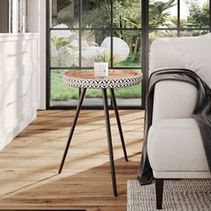 a living room scene with focus on the coffee table and chair in the foreground