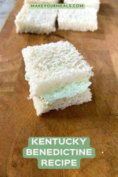 several pieces of cake sitting on top of a wooden cutting board