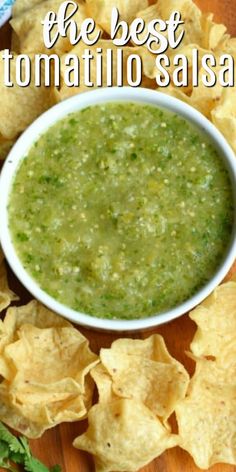 tortilla salsa in a white bowl surrounded by tortilla chips and cilantro