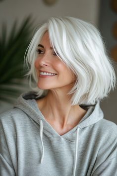 Click for More ➡️ | Save for Later ❤️A feathered bob with light, whispery layers that create a soft, ethereal effect. Perfect for women seeking a feminine and lighthearted style. (Feathered Bob with Whispery White Layers - Haircuts For Older Women With White Hair)