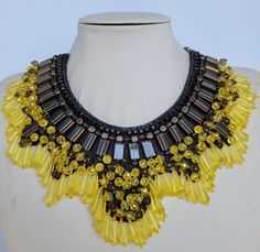 Each piece of our statement necklaces is handmade and one of a kind made in Italy. Our creations is made of high quality materials such as crystals and rhinestones. Each embroidered material is carefully hand sewn. Very glamorous and stylish. Perfect gift to someone you like. Materials Strass stone and Rhinestone in Yellow and transparent color in different dimension.  Black leather backing. Aluminium chain with lobster closure. Measurements Weight approximate 300 grams. Chain lenght 25 cm - 9.8 Unique Yellow Choker Necklace, Unique Yellow Necklace For Party, Handmade Yellow Necklace For Party, Embroidered Material, Necklace Swarovski, Necklace Collar, Jewel Necklace, Crystal Necklaces, Swarovski Necklace