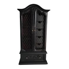 an ornate black cabinet with glass doors on the top and bottom shelf, in front of a white background