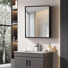 a bathroom with a sink, mirror and shelves on the wall next to it in front of a window