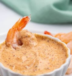 a shrimp dipping sauce in a white bowl