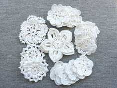 white crocheted doily on grey fabric