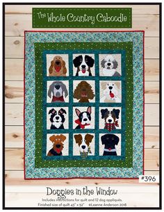 a quilt with dogs on it and the words, dogpaps in the window