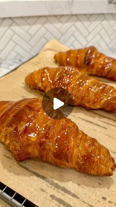 two croissants sitting on top of a counter