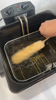 someone is frying some food in an air fryer