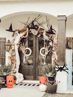 the front entrance to a house decorated for halloween