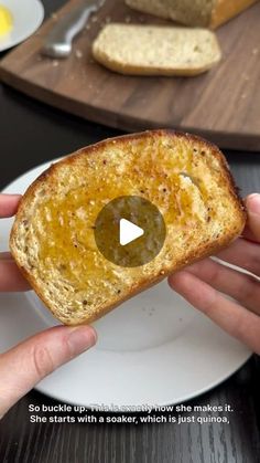 someone is holding a piece of bread with an olive on it and the video appears to be showing