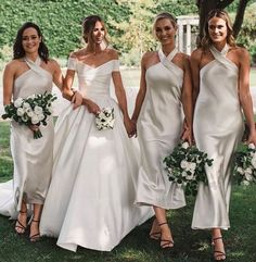 the bridesmaids are all dressed in white dresses